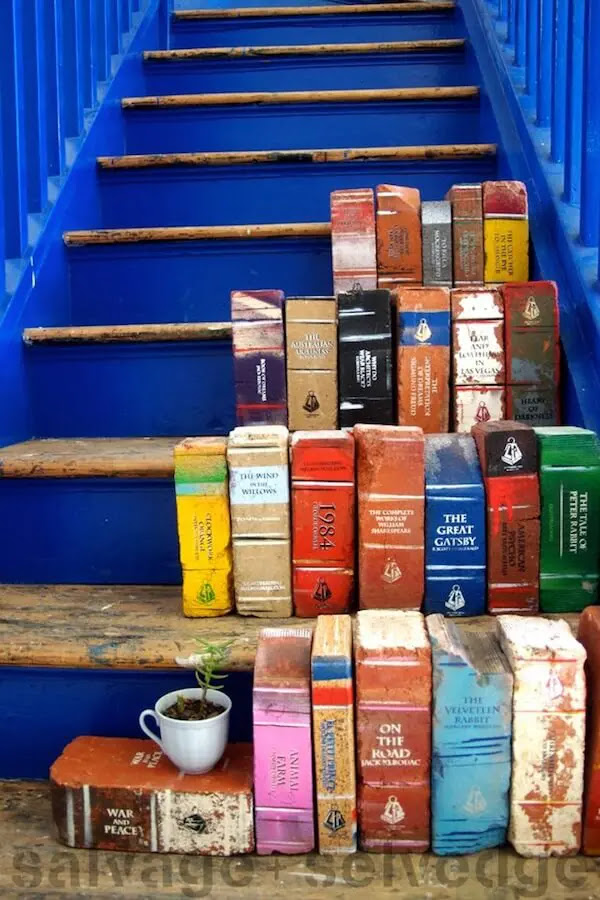 Brick books on a blue staircase
