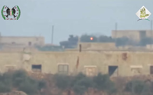 Footage shows the missile (orange dot, center right) tracking towards the tank (center left) before colliding with its main turret, despite the tank being fitted with defense systems designed to stop it