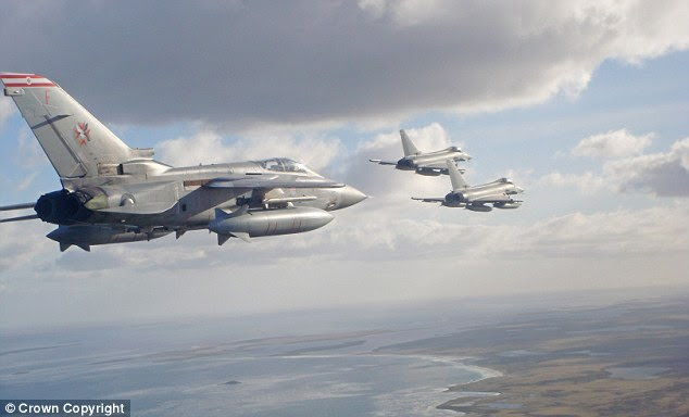 Typhoons are met by Tornado F3, left, as they arrive over the Falkland Islands for the first time