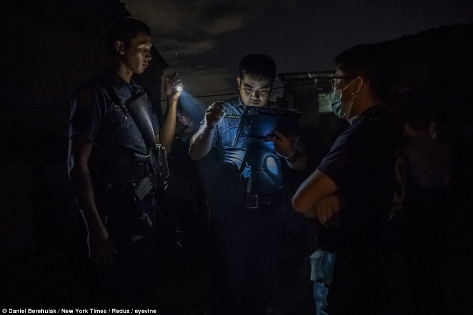 Police at the scene of Ronald Kalau's death, in Manila, Philippines