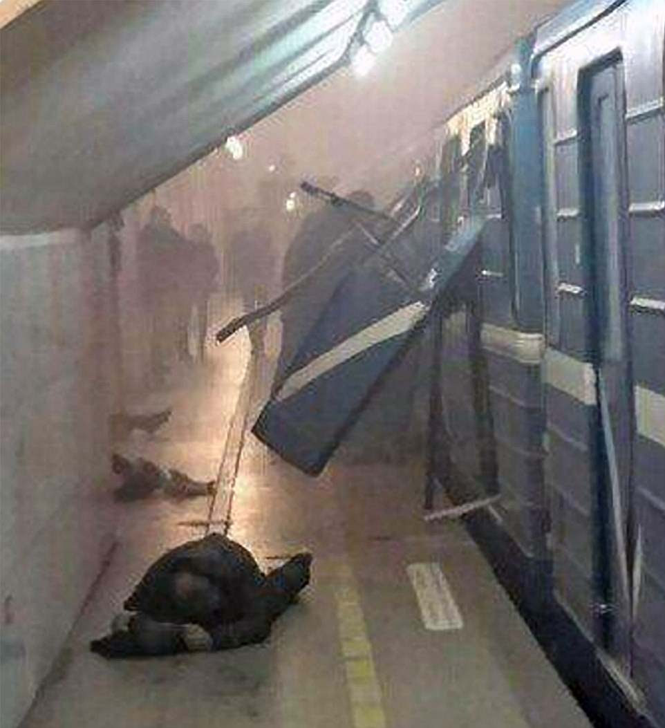 A man lies down on the platform after a bomb blast rips through a Metro carriage in the city of St Petersburg