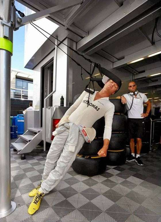 F1 2014 - Australian GP - Nico Rosberg training the neck muscles