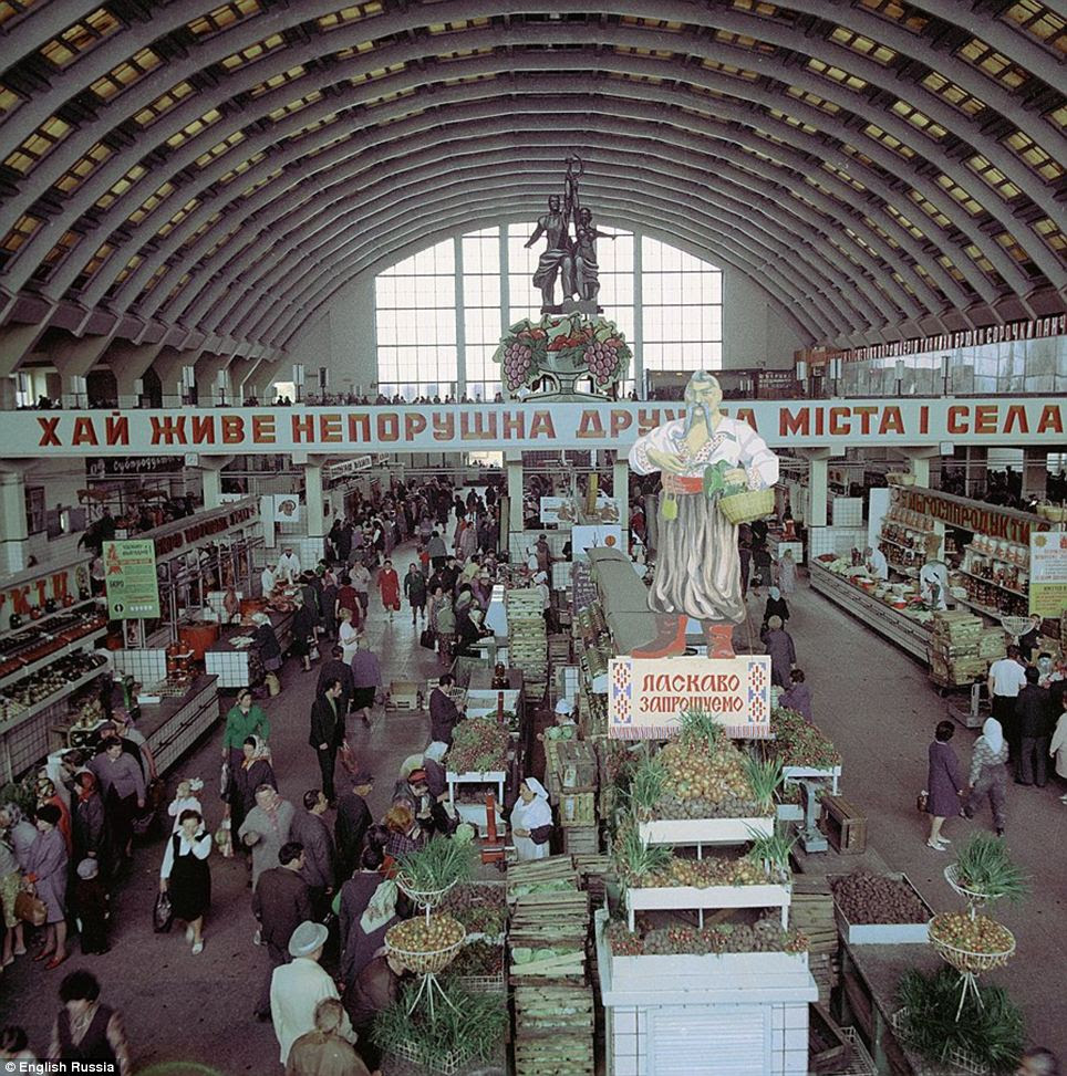 Land of plenty: A picture shows a market overflowing with fresh produce. The images document the country in the final year of Stalin's life