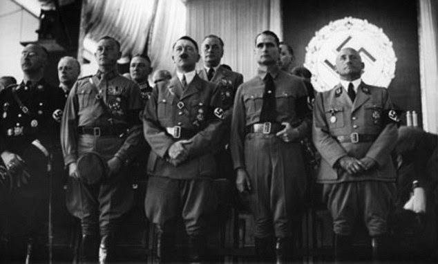 Resigned to death: Shortly after his speech, Hitler (front centre) was reported to have suffered a nervous collapse and subsequently saw death as a 'release'