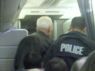 The man with the gray hair was escorted off the plane. (Photos courtesy of Janet Kim, WKYT)