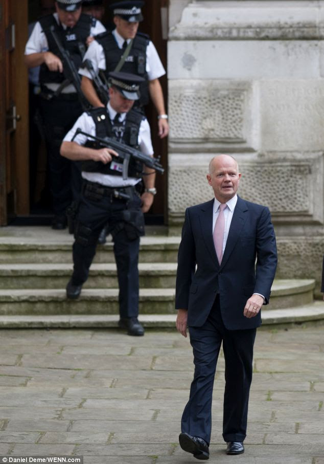 Summit: Foreign Secretary William Hague arrives at 10 Downing Street for a meeting with Prime Minister David Cameron this morning 