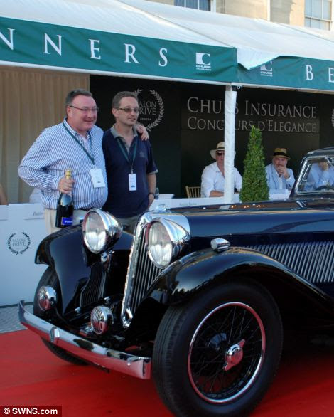 Classic car owner James Hull (standing, left) with his award winning Jaguar SS1