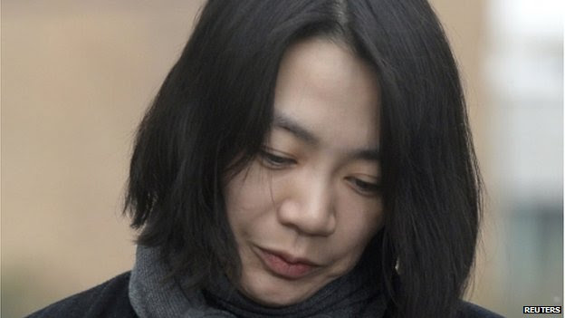 Cho Hyun-ah, also known as Heather Cho, daughter of chairman of Korean Air Lines, Cho Yang-ho, appears in front of the media outside the offices of the Aviation and Railway Accident Investigation Board of the Ministry of Land, Infrastructure, Transport, in Seoul 12 December 2014