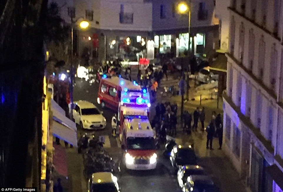 The horror started with Kalashnikov-wielding fanatics attacking Cambodian restaurant Le Petit Cambodge in the Bastille area of the city at around 9pm. Pictured, emergency services at the scene