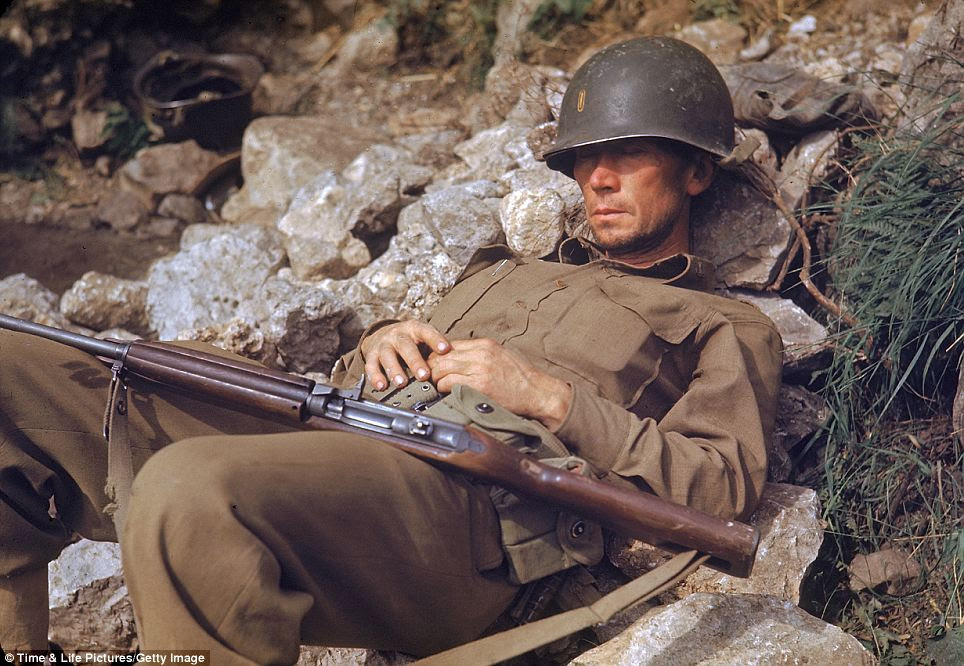 Casualties of war: An American soldier sleeps on a pile of rocks. The Italian Campaign was long a bloody and saw the deaths of tens of thousands of soldiers on both sides, as well as many thousands of civilian casualties