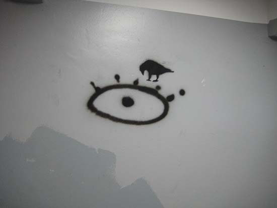 Argentine, Buenos Aires, university, enigmatic/hieroglyphic graffiti: crow with human eye