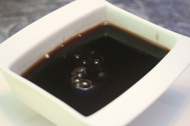 Liquid warm grass jelly that solidifies as it cools