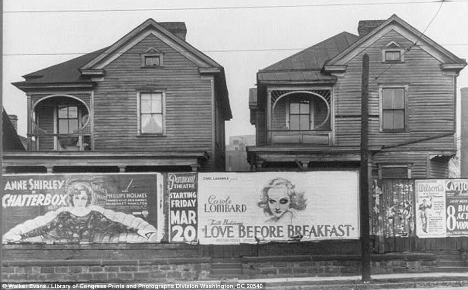 Rundown: Houses in Atlanta, Georgia, in 1936, alongside ads promoting movies from the time such as Love Before Breakfast starring Carole Lombard