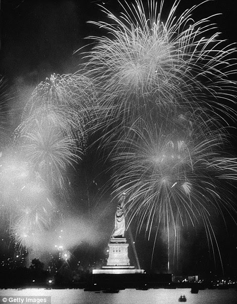 Fireworks explode around the Statue of Liberty in 1976