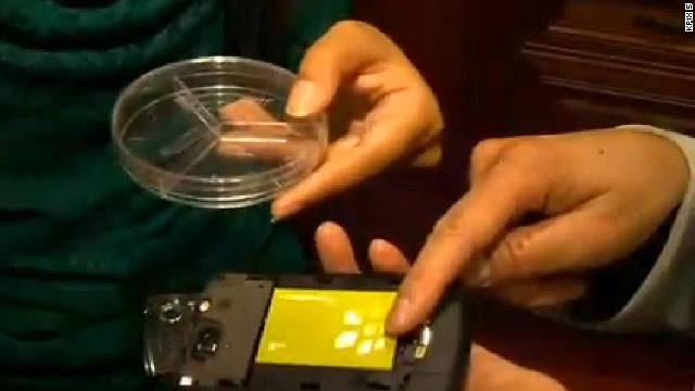 In this image from CNN affiliate KPIX, 18-year-old Eesha Khare shows off her device that can charge phones in seconds.