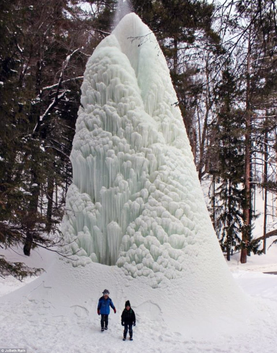 Incredible: America's record-breaking big freeze has sparked an array of dramatic, terrifying and often amusing scenes - and the bitter cold is not over just yet. Above, this pressure-fed fountain in Letchworth State Park, New York, was transformed into a five-story-high 'ice volcano' this week following days of sub-zero temperatures and heavy snow. Amazingly, water continues to spout out of its top