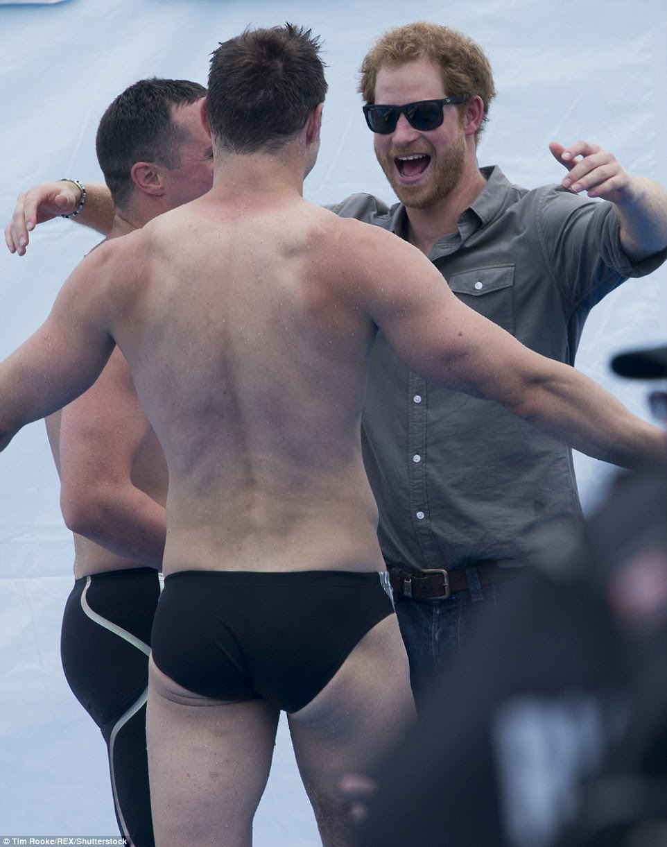 Despite having got a little damp earlier it wasn't long before the prince was going back for more hugs with his swimming team