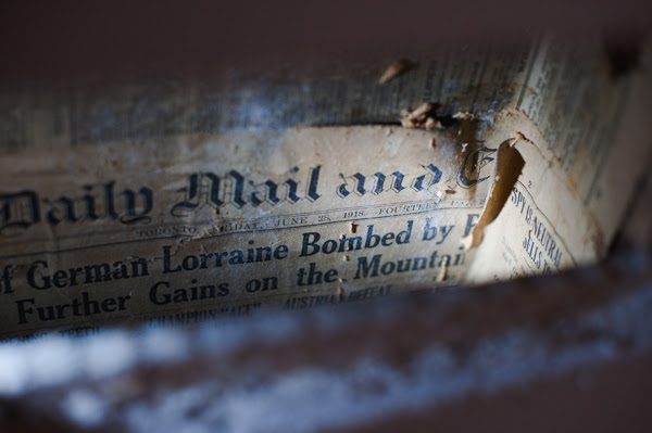 newspaper in the walls