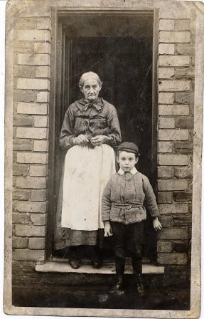 Woman and boy standing on doorstep