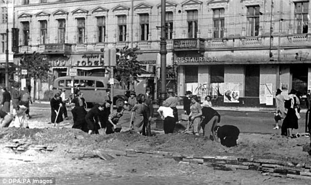 Jewish residents in Warsaw are working as forced laborers in the streets of the Polish capital. (Undated picture)