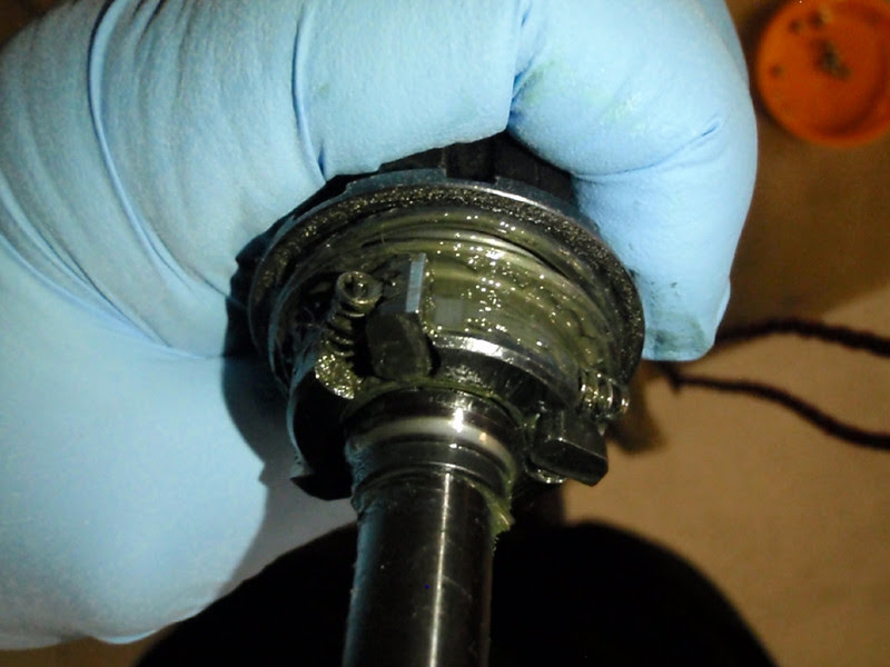 Instead of dry and cracked, the old greasy was almost a liquid. The pawls and springs just fell out into my hand. Bearing cone looks worn, but in good shape. Instead of dry and cracked, the old greasy was almost a liquid. The pawls and springs just fell out into my hand. Bearing cone looks worn, but in good shape.