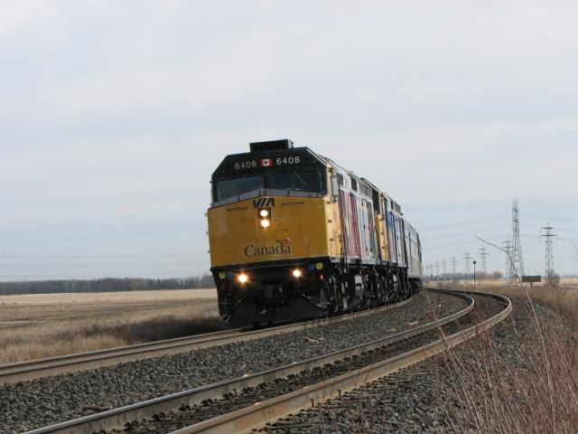 VIA 6408 and the Canadian rounding the bend
