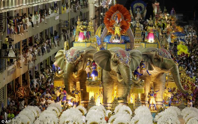 The Vila Isabel samba school performs during the carnival parade in Rio de Janeiro, Brazil, earlier today