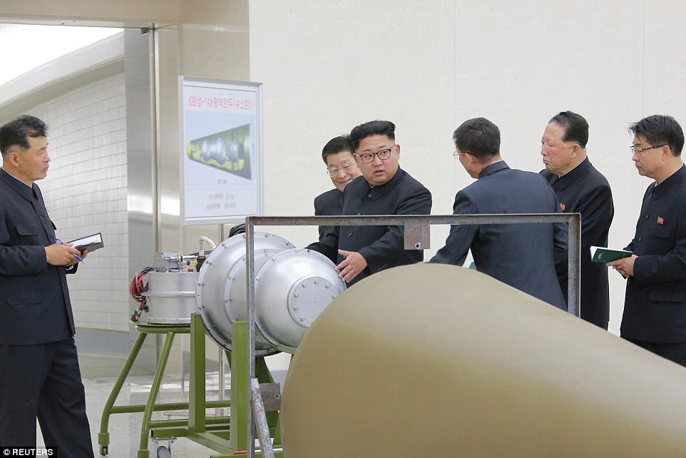 The hydrogen bomb's power is adjustable and can be detonated at high altitudes, North Korea said (Kim pictured in photos released Sunday)