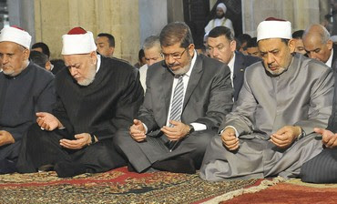 MOHAMED MORSI, center, prays at Al-Azhar mosque in