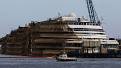 PHOTO: The Costa Concordia is seen after it was lifted upright, on the Tuscan Island of Giglio, Italy, early Tuesday morning, Sept. 17, 2013.