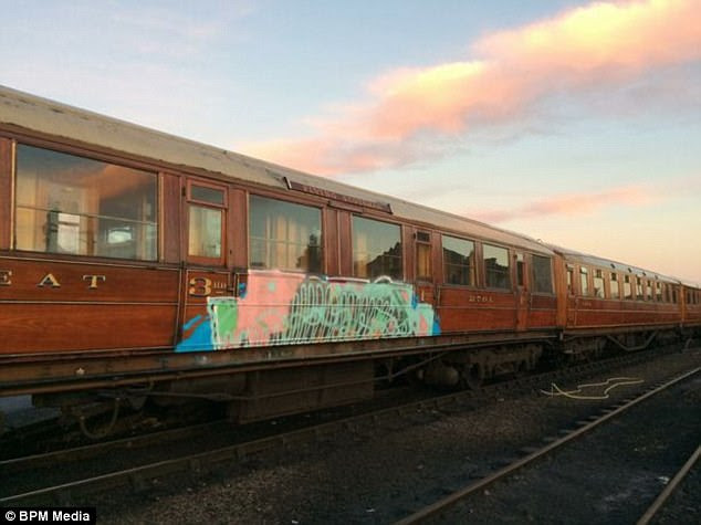 They struck over the festive period daubing a crude 'Banksy' on one carriage and spraying another with graffiti
