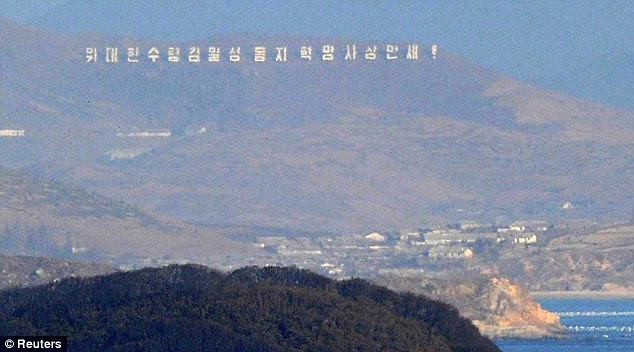 Rumbling in the hills: North Korea is seen today from Yeonpyeong island, where residents heard artillery fire 