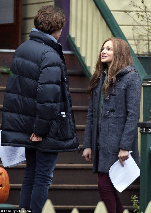 On-screen romance:  Chloe Moretz laughed with her on-screen boyfriend Jamie Blackley on the set of If I Stay in Vancouver, British Columbia