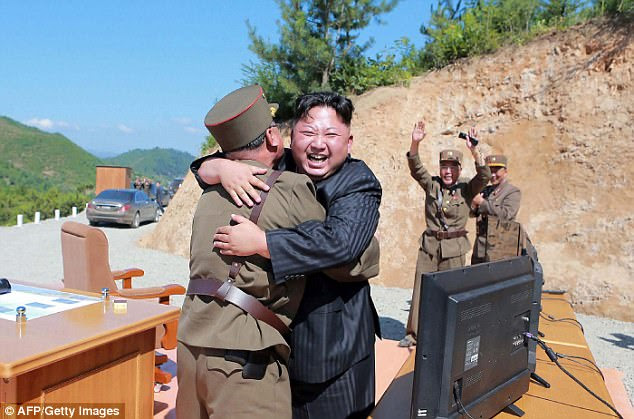 The US intercept test comes after North Korea fired an intercontinental ballistic missile capable of reaching parts of the United States for the very first time Pictured: Kim Jong-Un celebrating the first successful test launch on July 4