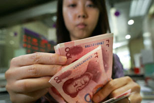 Chinese citizen counting money amid the global economic crisis. The Chinese Premier expressed concern over the $1 trillion in US debt held by the Asian nation. by Pan-African News Wire File Photos