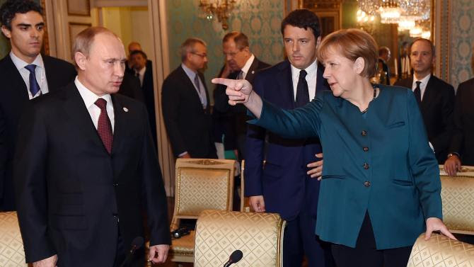 German Chancellor Angela Merkel, right, Russian President Vladimir Putin, left, and  Italian Prime Minister Matteo Renzi arrive for a meeting on the sidelines of the  ASEM summit of European and Asian leaders in Milan, northern Italy, Friday, Oct. 17, 2014. Russian President Vladimir Putin is looking to get relief from Western economic sanctions imposed since Russia&#39;s annexation of the Crimean Peninsula and its support for a pro-Russia insurgency in eastern Ukraine. To that end, he has scheduled a series of meetings on the sidelines of a two-day ASEM summit of European and Asian leaders. (AP Photo/Daniel Dal Zennaro, POOL)