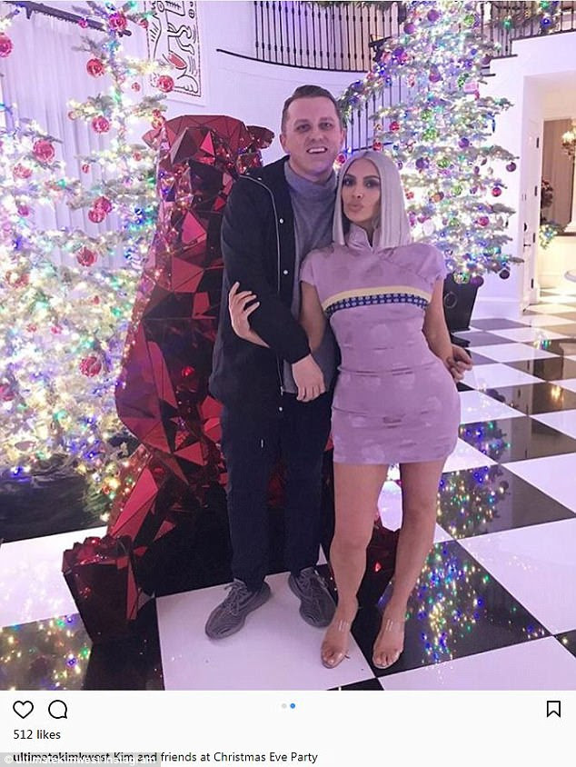 What a look: Kim Kardashian wowed in a vintage 1997 Dior mini dress; pictured with a pal at the Kardashian Jenner Christmas Eve on Sunday