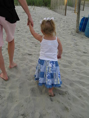 Clara Ann walks in the sand