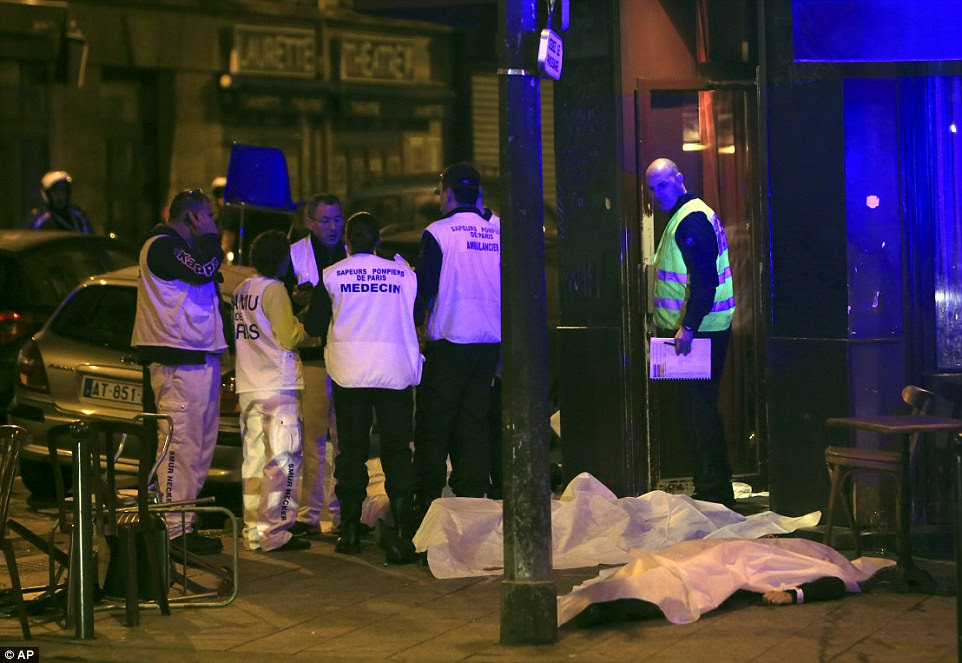 Two police officials said at least 11 people were killed in the restaurant shootout in Paris
