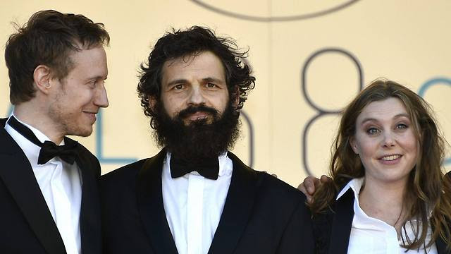 Director Laszlo Nemes, actor Geza Rohrig and screenwriter Clara Royer arrive for the screening Son of Saul during the 68th annual Cannes Film Festival (Photo: EPA)