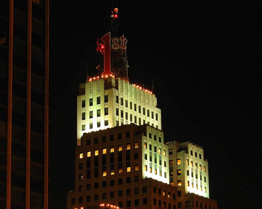 Nighttime view of the First National Bank building in downtown St Paul.