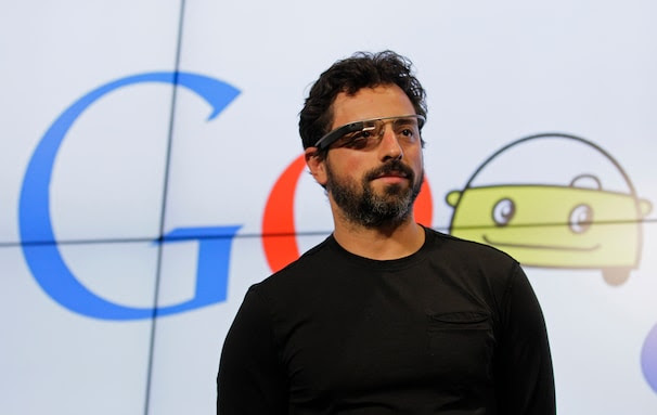 Google co-founder Sergey Brin stands on stage during a bill signing by California Gov. Edmund G. Brown Jr., for driverless cars at Google headquarters in Mountain View, Calif., Tuesday, Sept. 25, 2012.  The legislation will open the way for driverless cars in the state. Google, which has been developing autonomous car technology and lobbying for the legislation has a fleet of driverless cars that has logged more than 300,000 miles (482,780 kilometers) of self-driving on California roads. (AP Photo/Eric Risberg)