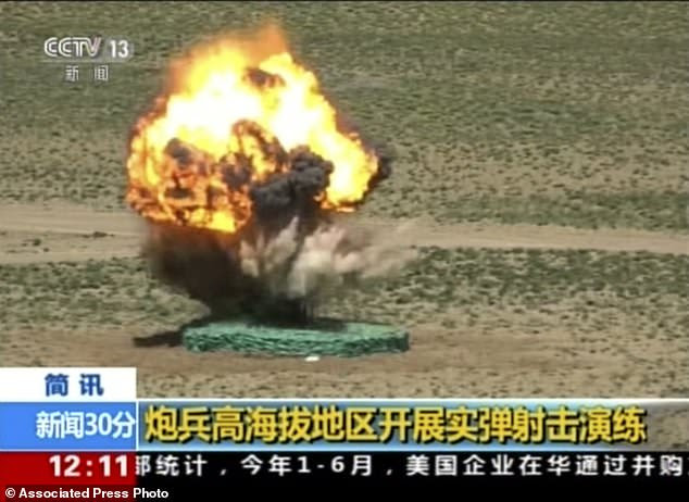 In this image taken from a recent video footage run by China's CCTV on Friday, Aug 4, 2017, a target explodes during a live-fire drill by the Chinese army in a region that borders India