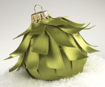 Green ball Christmas ornament covered with satin strips