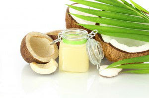 coconut oil with dry coconut and leaves