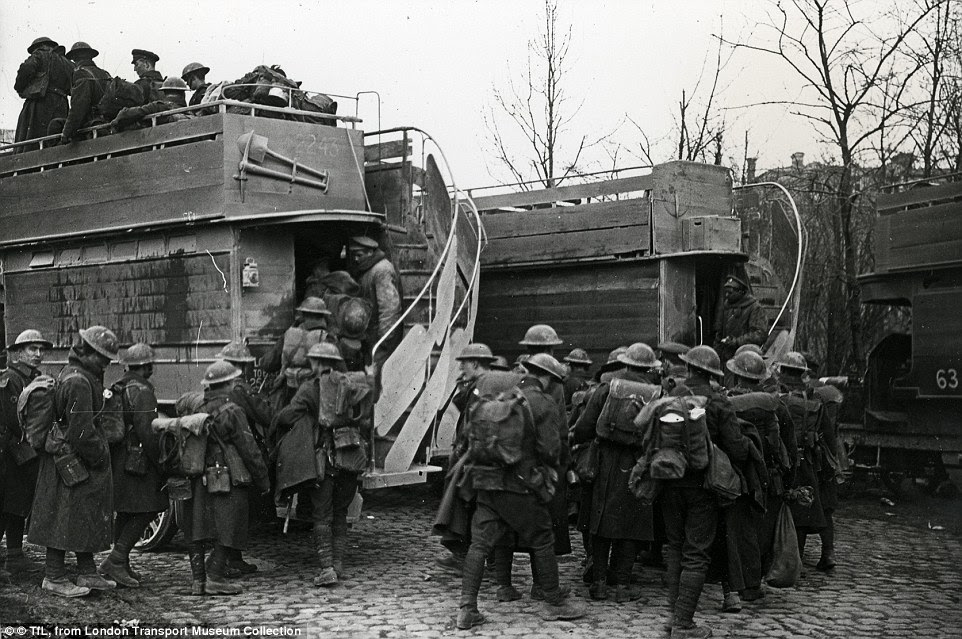 Transport from London: Soldiers in combat gear board B-type battle buses, which could each carry 24 soldiers, near Arras, France in 1915