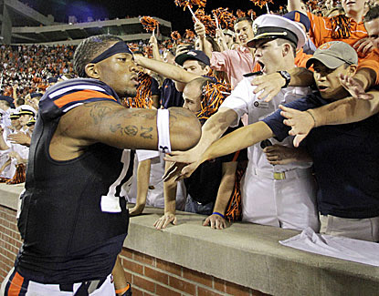 Nick Marshall celebrates with the Auburn fans after his two-touchdown game in the Tigers' victory over Ole Miss. (USATSI)