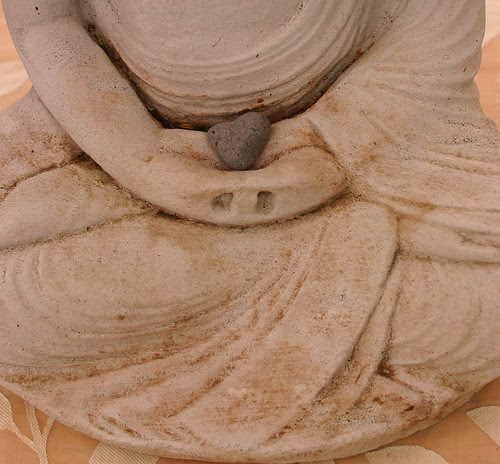 heart stone in the Buddha's hands
