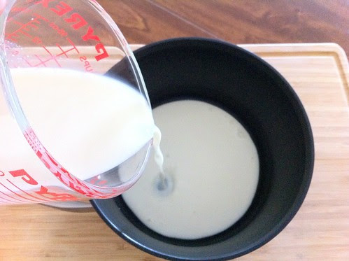 Pouring Milk into a Sauce Pan