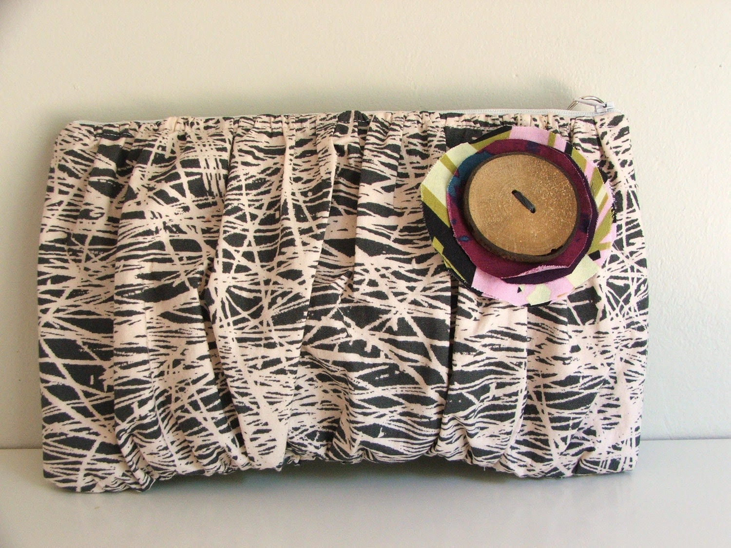 Gathered clutch with handmade button